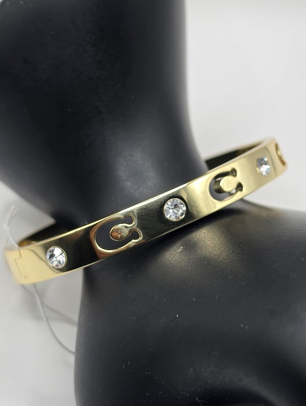Coach Signature Stone Sculpted C Hinged Bangle